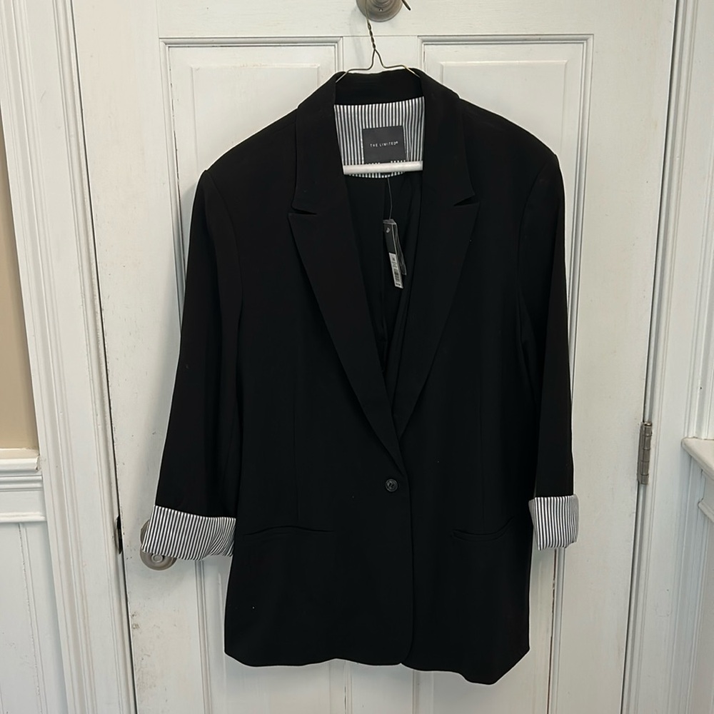 Brand new with tags on black blazer single buttton . Cute pinstripe cuffs